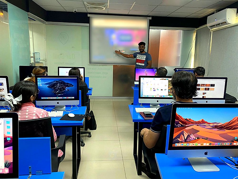 A BBT instructor teaching at the projector